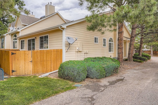 8346 S Upham Way, Littleton, CO 80128 - view of home's exterior featuring a chimney