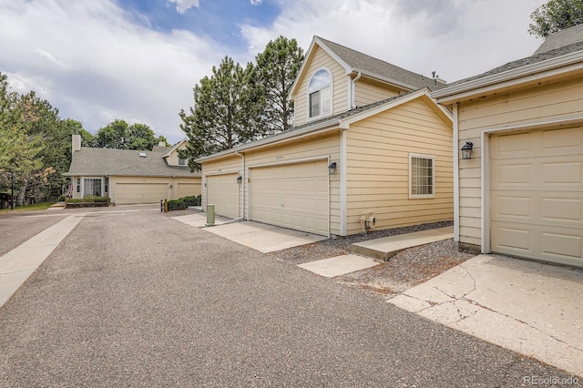 8346 S Upham Way, Littleton, CO 80128 - view of side of home with a garage