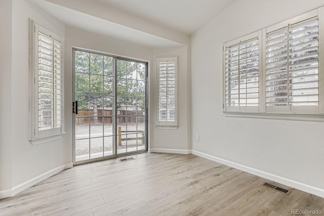 8346 S Upham Way, Littleton, CO 80128 - spare room featuring baseboards and wood finished floors
