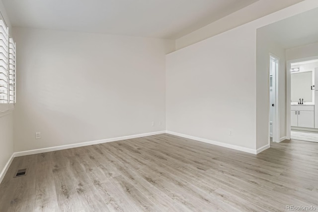 8346 S Upham Way, Littleton, CO 80128 - spare room with light wood-style floors and baseboards