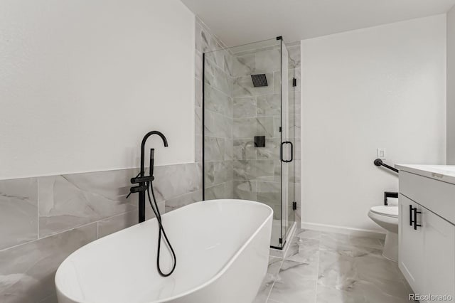 8346 S Upham Way, Littleton, CO 80128 - bathroom with vanity, a freestanding tub, marble finish flooring, and a stall shower