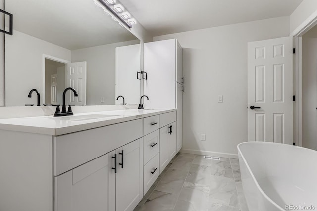 8346 S Upham Way, Littleton, CO 80128 - bathroom with marble finish floors, double vanity, and a soaking tub