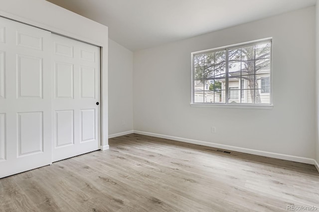 8346 S Upham Way, Littleton, CO 80128 - unfurnished bedroom with wood finished floors and a closet