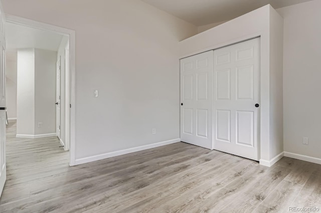 8346 S Upham Way, Littleton, CO 80128 - unfurnished bedroom featuring light wood-type flooring and a closet