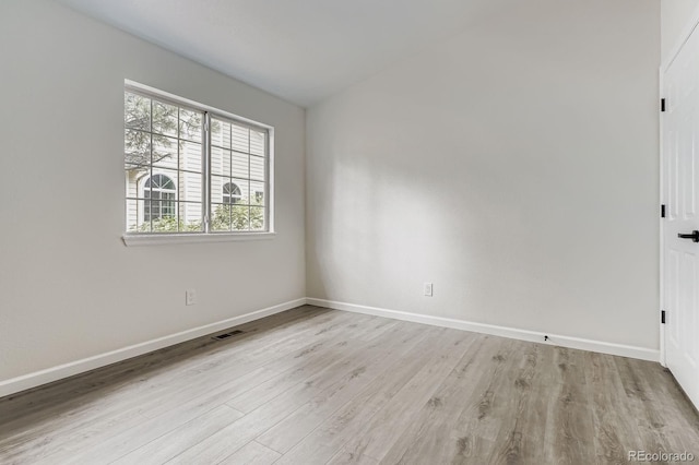 8346 S Upham Way, Littleton, CO 80128 - empty room featuring baseboards and wood finished floors