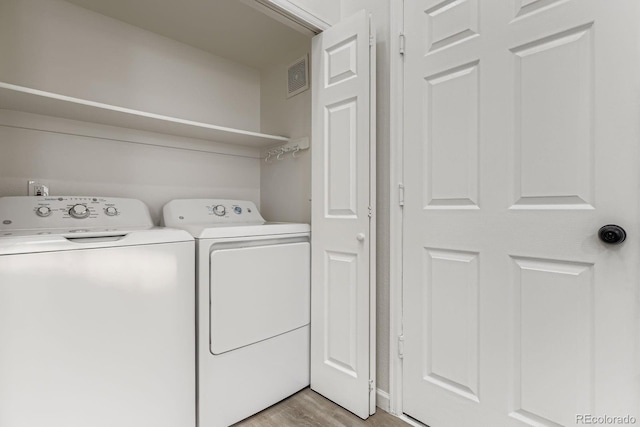 8346 S Upham Way, Littleton, CO 80128 - washroom with washer and dryer and light wood finished floors