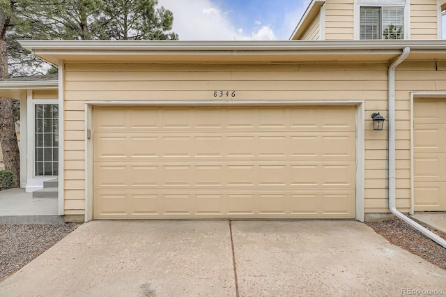8346 S Upham Way, Littleton, CO 80128 - garage featuring concrete driveway
