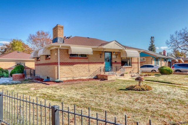 ranch-style home with a front lawn