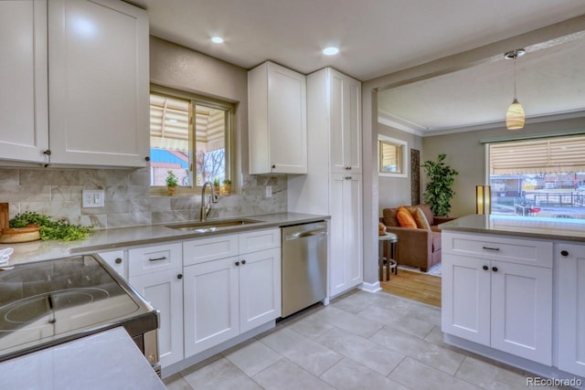 kitchen with pendant lighting, dishwasher, stove, white cabinets, and crown molding