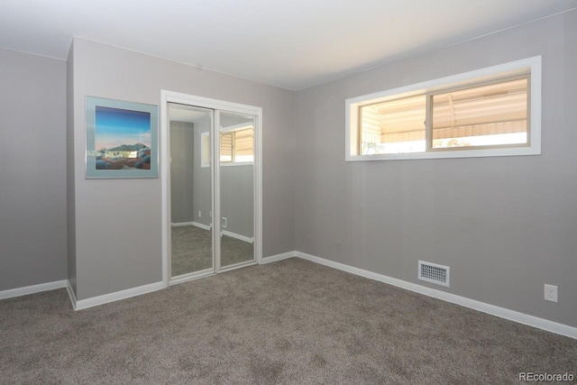 empty room with carpet and a healthy amount of sunlight