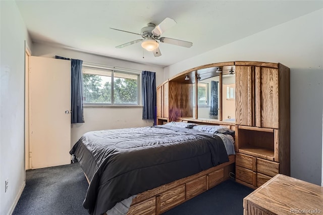 5673 Johnson St, Arvada, CO 80002 - bedroom with arched walkways, ceiling fan, and dark carpet