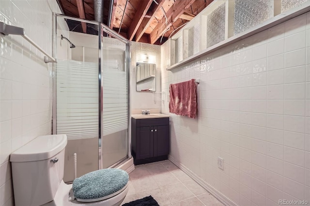 5673 Johnson St, Arvada, CO 80002 - bathroom with a stall shower, vanity, and tile walls