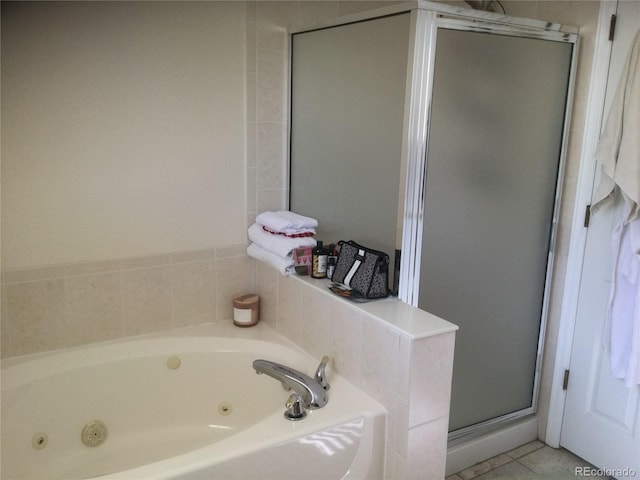 bathroom featuring tile patterned floors and plus walk in shower