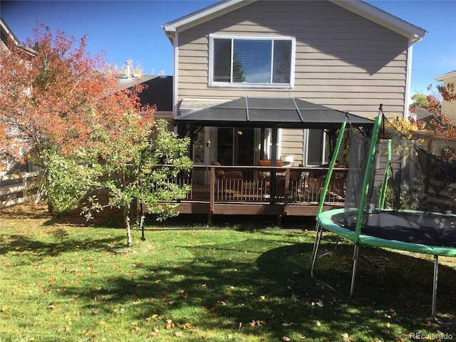 13674 Plaster Cir, Broomfield, CO 80023 - rear view of house with a trampoline, a yard, a deck, and a gazebo