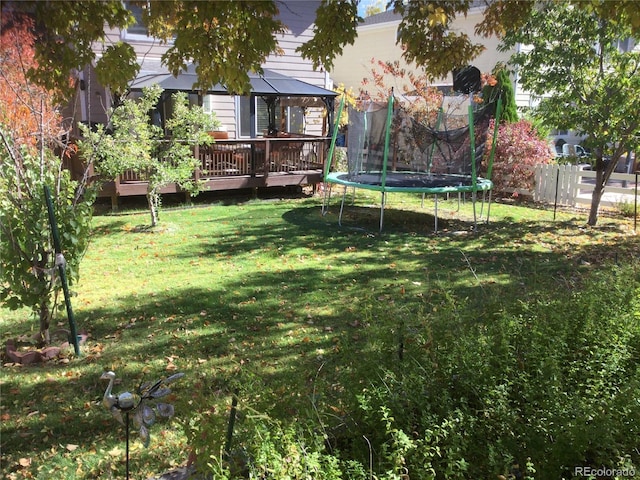 13674 Plaster Cir, Broomfield, CO 80023 - view of yard featuring a gazebo, a trampoline, and a deck