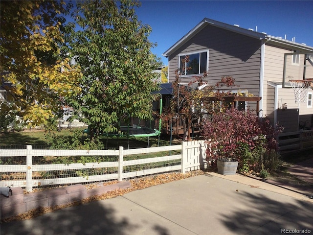 13674 Plaster Cir, Broomfield, CO 80023 - view of front of home with a trampoline and a patio area