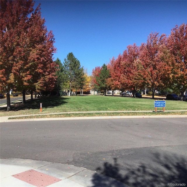 13674 Plaster Cir, Broomfield, CO 80023 - view of asphalt road with sidewalks