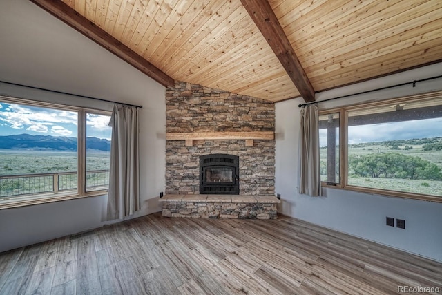 1610 Timber Ridge Rd, Westcliffe, CO 81252 - unfurnished living room with a fireplace, wood finished floors, wood ceiling, and a mountain view