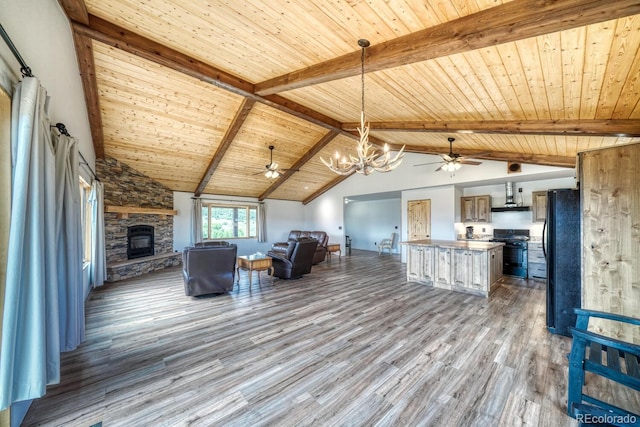 1610 Timber Ridge Rd, Westcliffe, CO 81252 - living room with ceiling fan, wooden ceiling, wood finished floors, a chandelier, and a fireplace