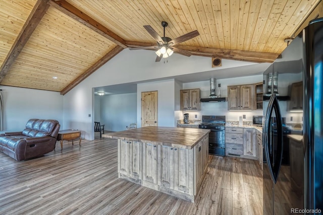 1610 Timber Ridge Rd, Westcliffe, CO 81252 - kitchen featuring black appliances, wall chimney exhaust hood, wood counters, wood finished floors, and open floor plan