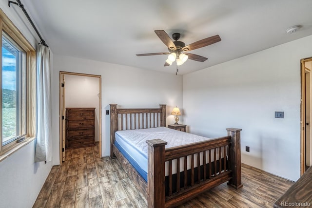 1610 Timber Ridge Rd, Westcliffe, CO 81252 - bedroom with wood finished floors, multiple windows, and a ceiling fan