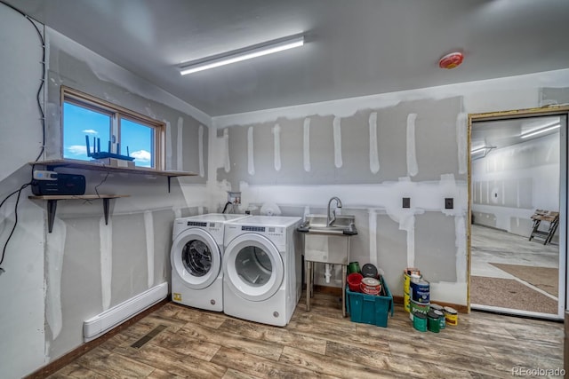 1610 Timber Ridge Rd, Westcliffe, CO 81252 - laundry area with separate washer and dryer and wood finished floors