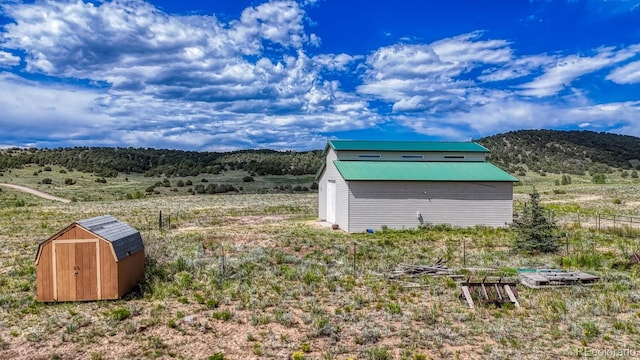 1610 Timber Ridge Rd, Westcliffe, CO 81252 - view of yard featuring a storage shed and a mountain view