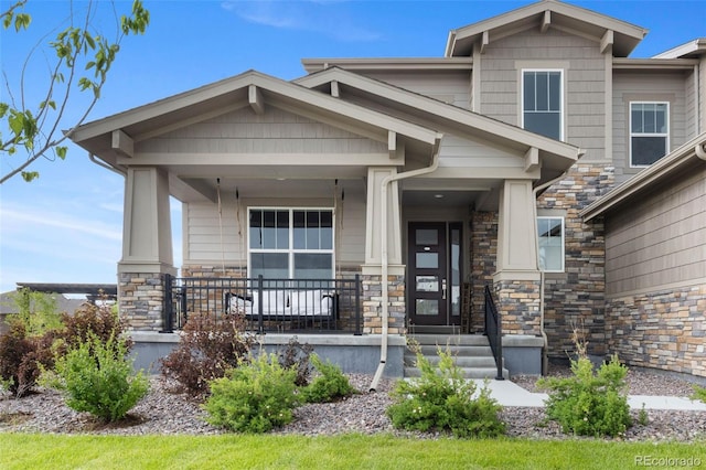 6614 S Vandriver Way, Aurora, CO 80016 - craftsman inspired home featuring stone siding and a porch