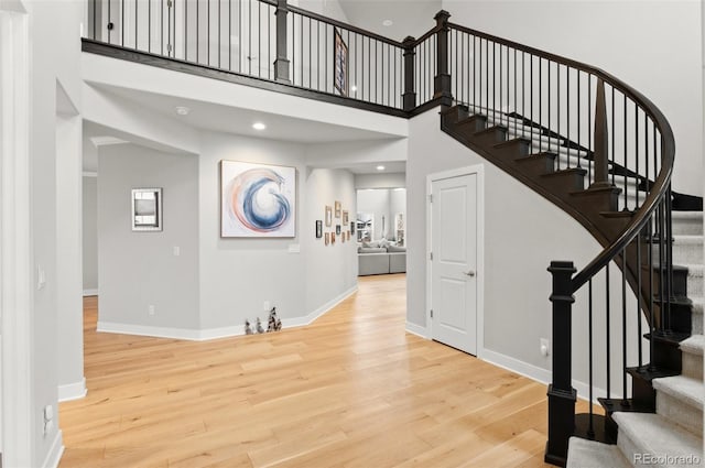 6614 S Vandriver Way, Aurora, CO 80016 - stairway featuring wood finished floors and a high ceiling