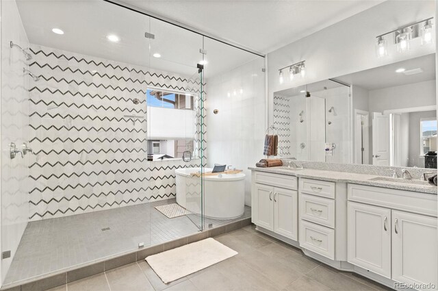 6614 S Vandriver Way, Aurora, CO 80016 - full bath with a stall shower, double vanity, a freestanding tub, tile patterned floors, and recessed lighting