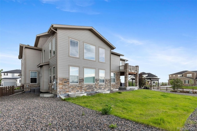 6614 S Vandriver Way, Aurora, CO 80016 - back of property with stone siding and a balcony