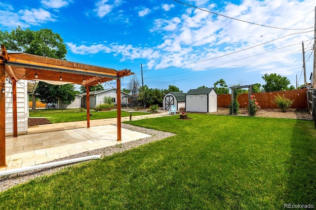 6390 W 45th Ave, Wheat Ridge, CO 80033 - fenced backyard featuring a storage unit and a patio area