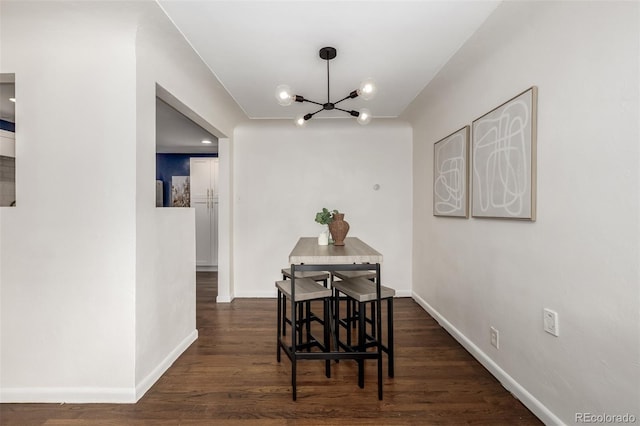 6390 W 45th Ave, Wheat Ridge, CO 80033 - dining space with a chandelier and dark wood finished floors