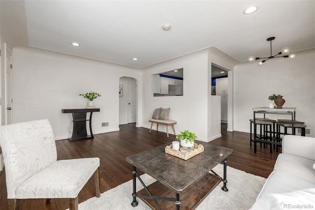 6390 W 45th Ave, Wheat Ridge, CO 80033 - living room with arched walkways, a chandelier, wood finished floors, and recessed lighting
