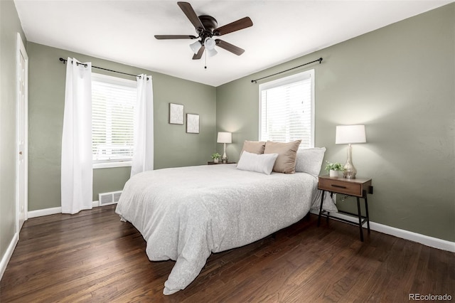 6390 W 45th Ave, Wheat Ridge, CO 80033 - bedroom featuring multiple windows, dark wood-style floors, and ceiling fan