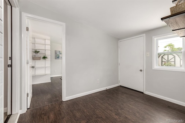 6390 W 45th Ave, Wheat Ridge, CO 80033 - spare room featuring dark wood-type flooring and baseboards