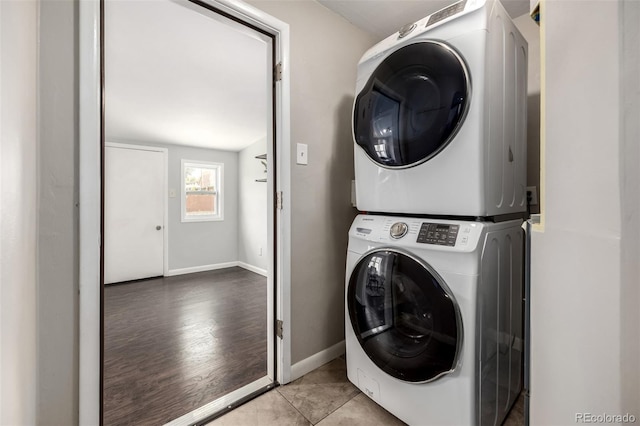 6390 W 45th Ave, Wheat Ridge, CO 80033 - washroom featuring estacked washer and dryer and wood finished floors
