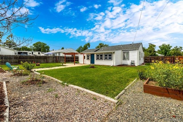 6390 W 45th Ave, Wheat Ridge, CO 80033 - back of house featuring a vegetable garden, a patio area, and a fenced backyard