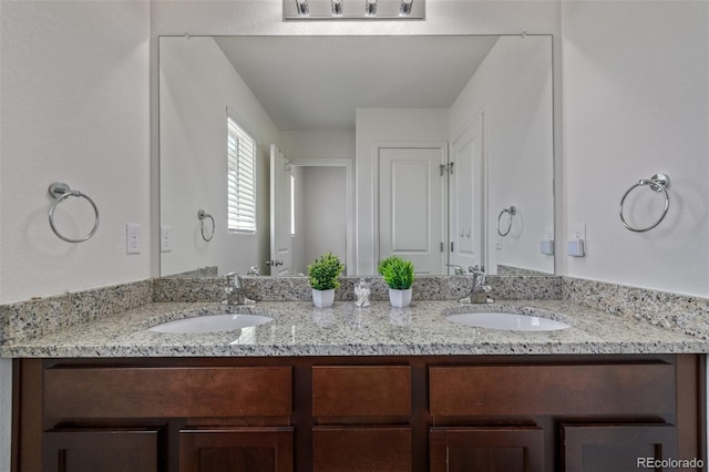 bathroom with double vanity and a sink