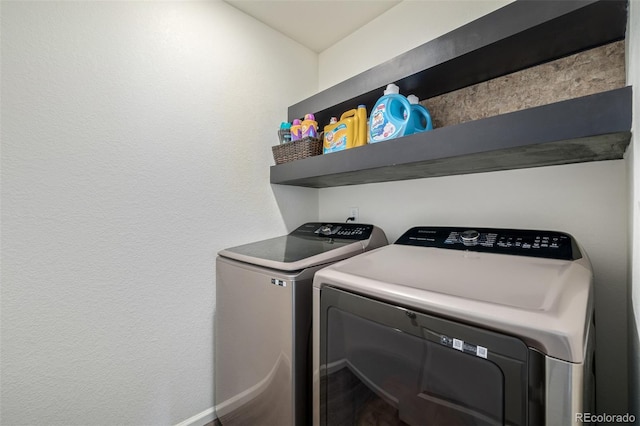 clothes washing area featuring laundry area and washer and dryer
