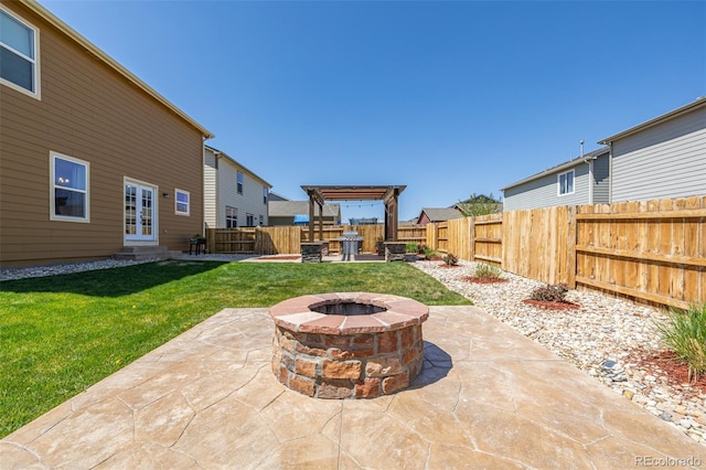 view of patio / terrace with entry steps, french doors, a fire pit, and a fenced backyard