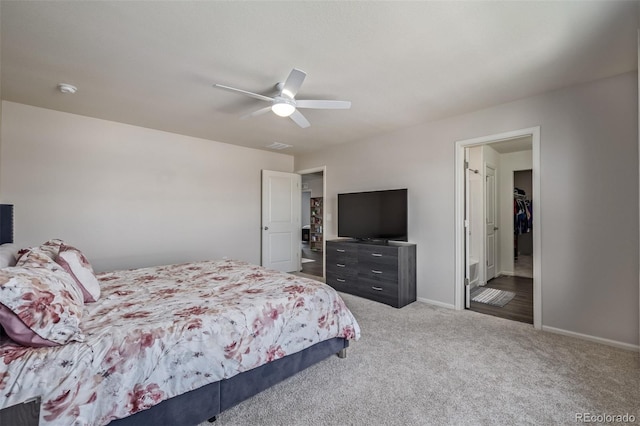 carpeted bedroom featuring baseboards, visible vents, and ceiling fan