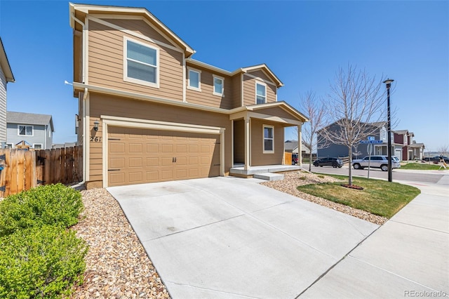 view of front of home featuring covered porch, fence, a garage, and concrete driveway