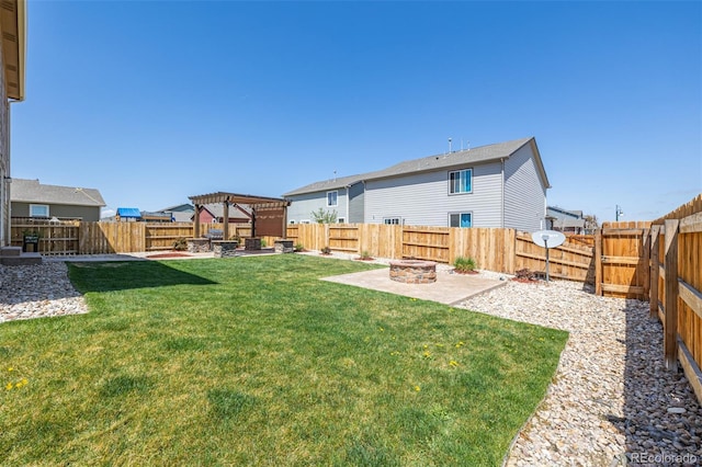 view of yard with a fenced backyard, an outdoor fire pit, a patio area, and a pergola