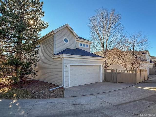 view of side of home with a garage