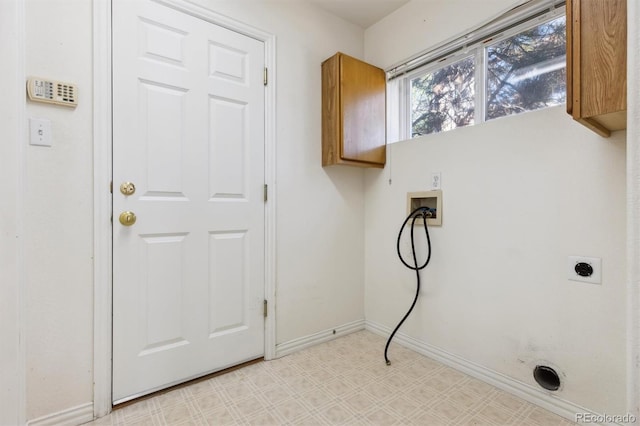 laundry room with washer hookup, hookup for an electric dryer, and cabinets