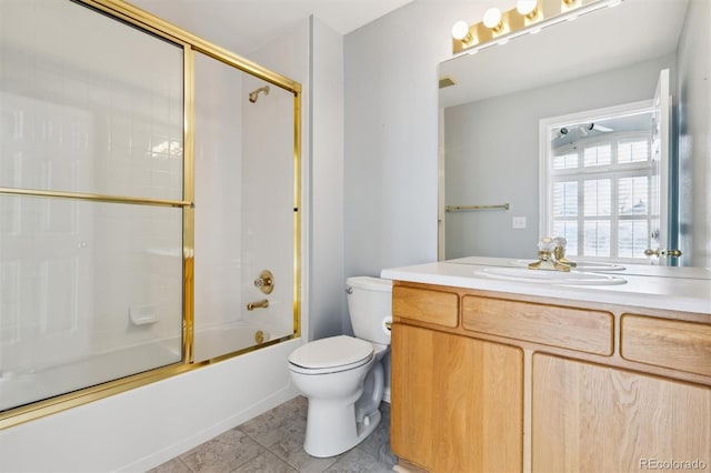 full bathroom featuring tile patterned flooring, toilet, vanity, and combined bath / shower with glass door