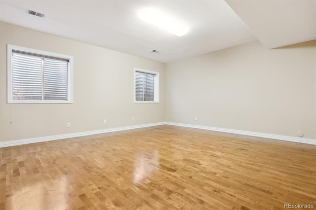 unfurnished room featuring light hardwood / wood-style flooring