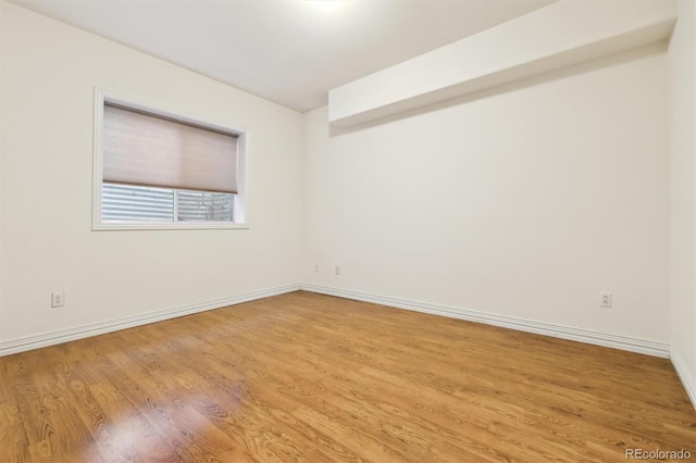 empty room with light wood-type flooring