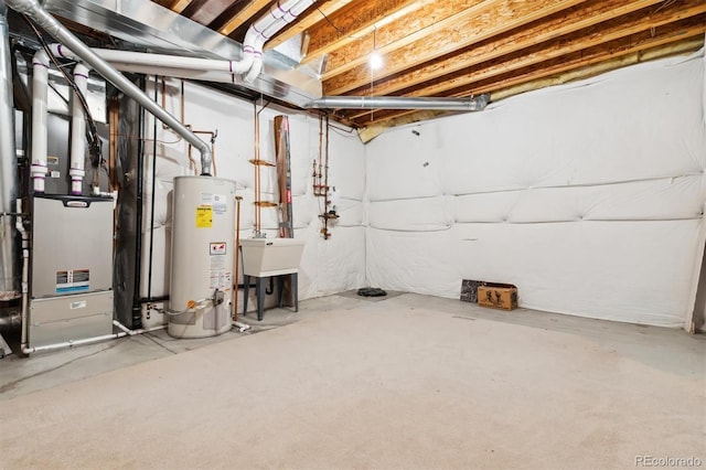 basement featuring sink and water heater